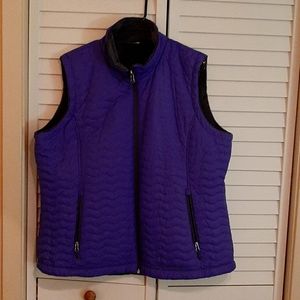 Reversible purple/gray sleeveless jacket.